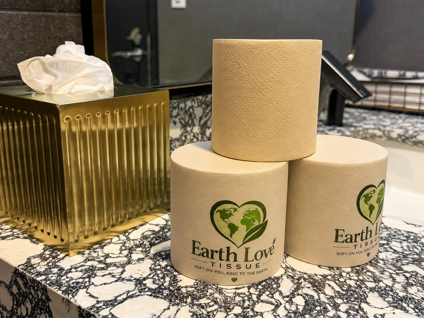 Earth Love Tissue rolls on a marble countertop